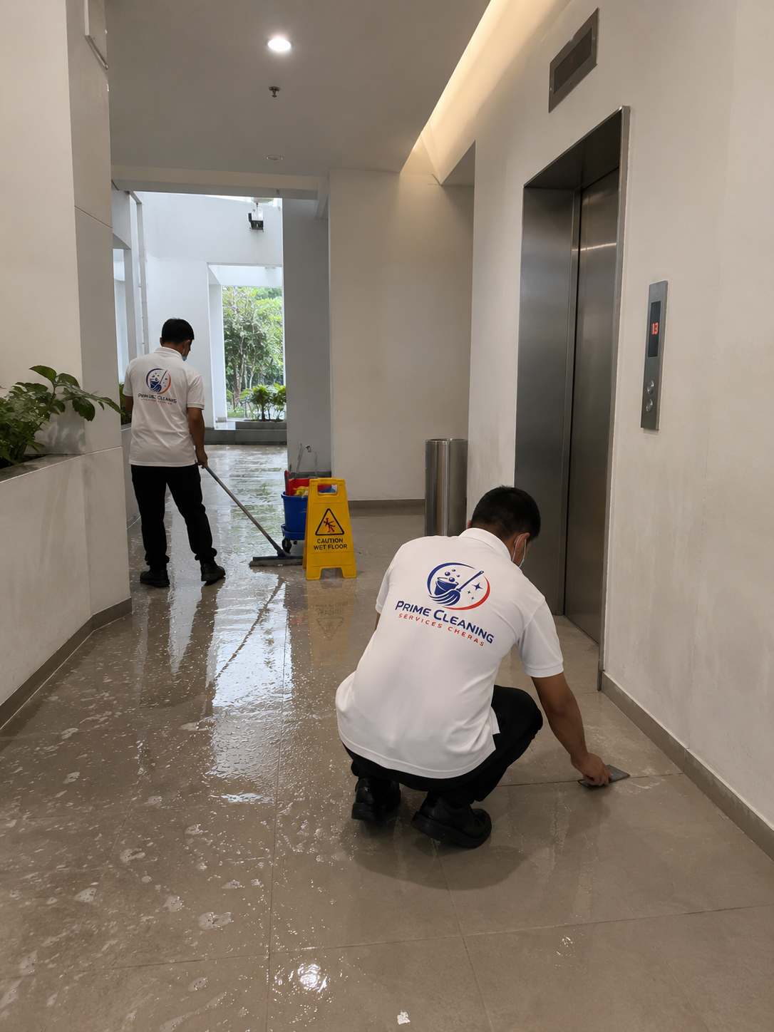 Prime Cleaning Cheras team cleaning a building lobby floor