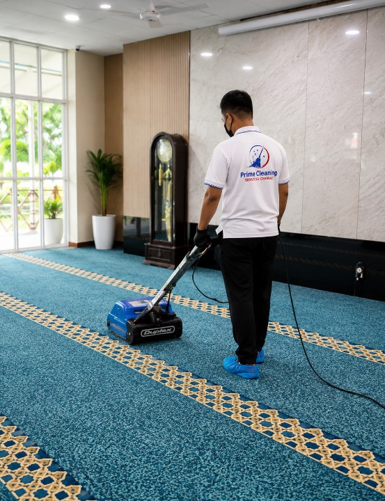 Prime cleaner extracting deep dirt from a patterned lobby carpet in Cheras