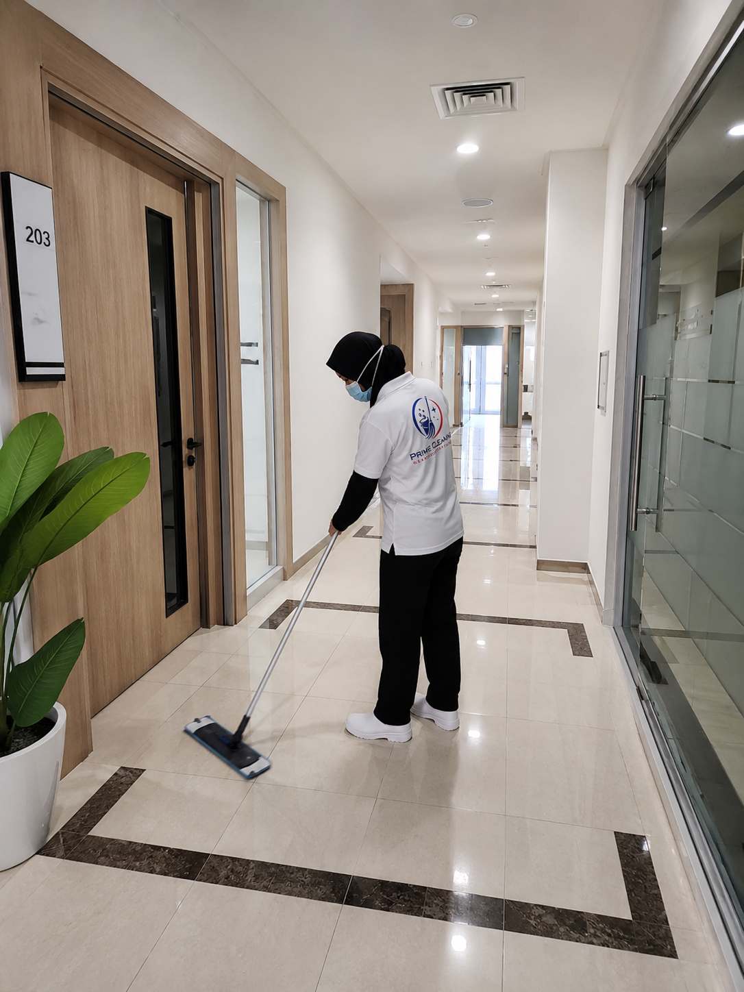 Prime cleaner mopping a hallway in Cheras